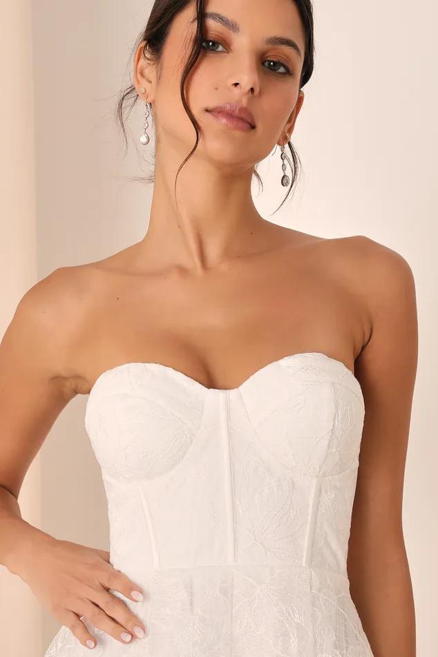 Score a Women's White Embroidered Strapless Mini Dress