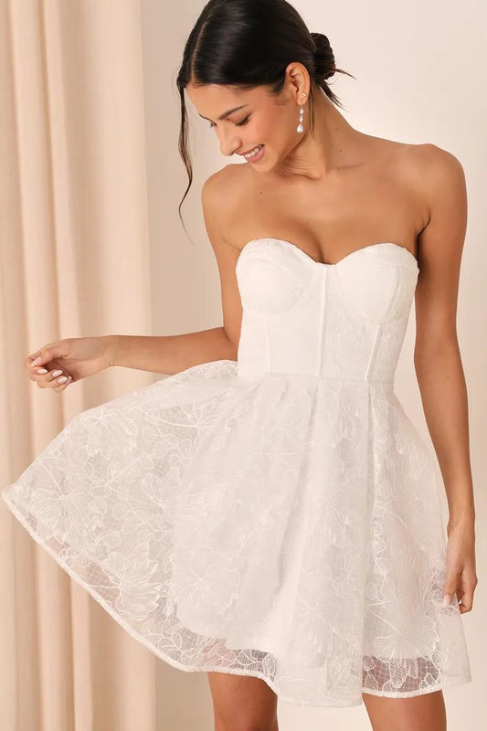 Score a Women's White Embroidered Strapless Mini Dress